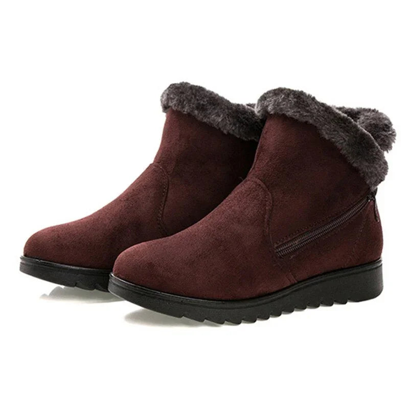 Women's brown suede ankle boots with faux fur trim and side zipper, black rubber soles