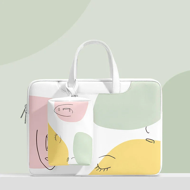 White laptop bag and pouch with abstract face art in pastel pink, yellow, and green on gray background