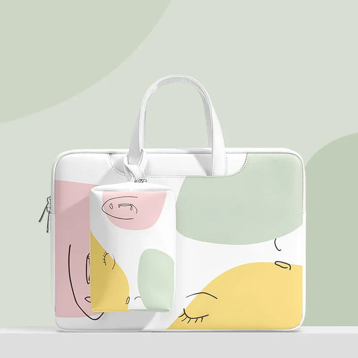 White laptop bag and pouch with abstract face art in pastel pink, yellow, and green on gray background