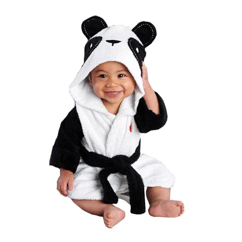 Smiling baby wearing a soft panda-themed hooded bathrobe with black and white design