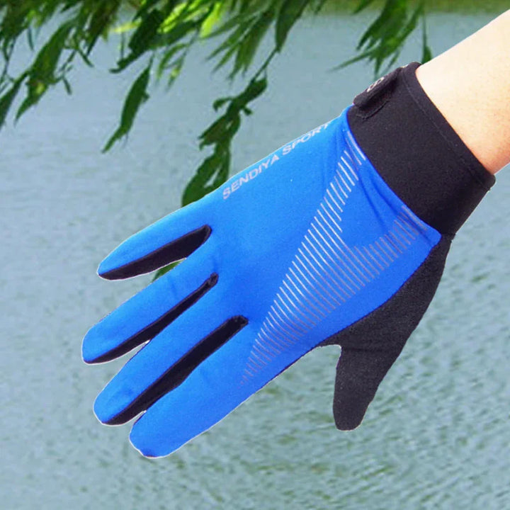 Blue Sendiya Sport glove with black accents worn by a hand outdoors near water