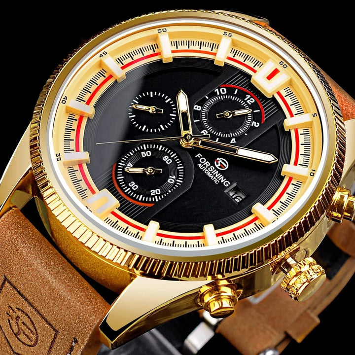 Close-up of Forsining automatic gold watch with black dial, three subdials, date window, and brown leather strap