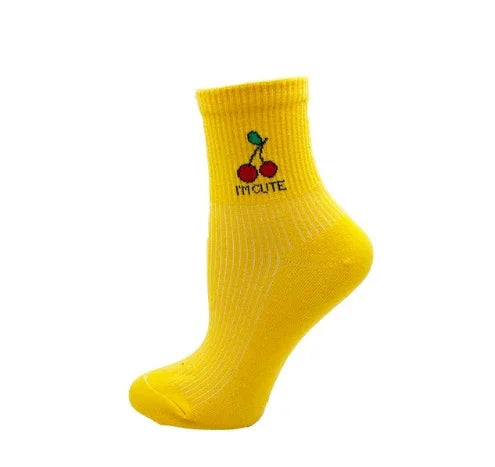 Yellow ankle sock featuring embroidered red cherries and text I'm Cute on white background