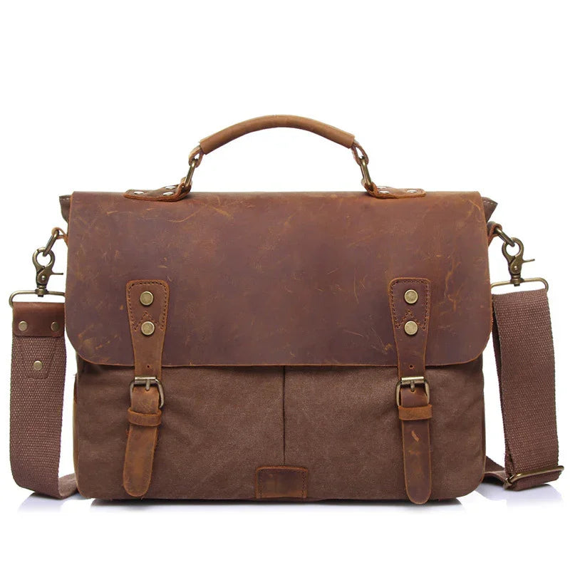 brown leather and canvas messenger bag with adjustable shoulder strap and top handle