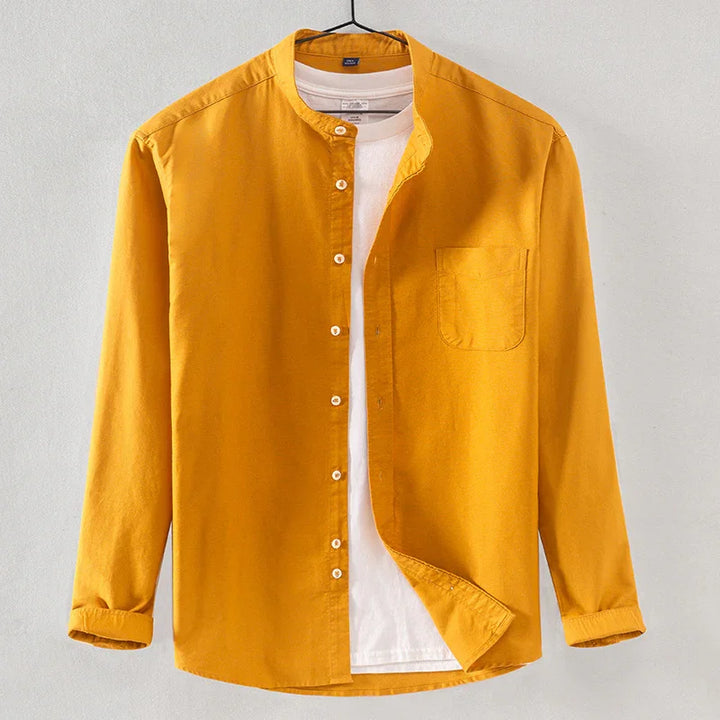 Mustard yellow mandarin collar shirt with white buttons over a white crew neck t-shirt on hanger