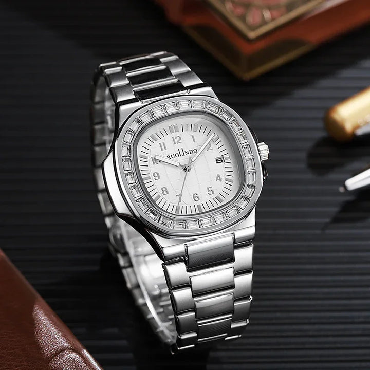 RUOLINDO silver stainless steel wristwatch with white dial and crystal bezel on black surface