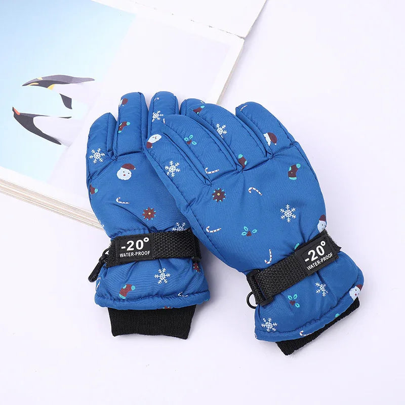 Blue waterproof winter gloves with snowflake, candy cane, and snowman patterns, -20° label