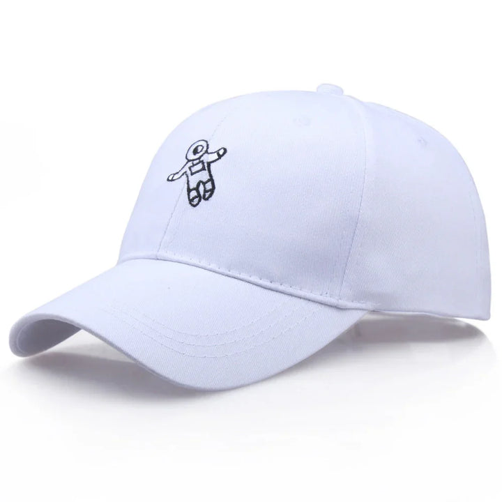 White baseball cap with small black embroidered astronaut design on front panel