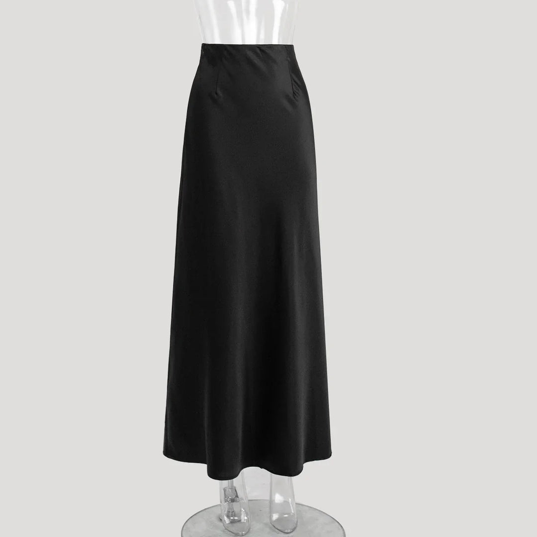 Black high-waisted maxi skirt on clear mannequin against white background