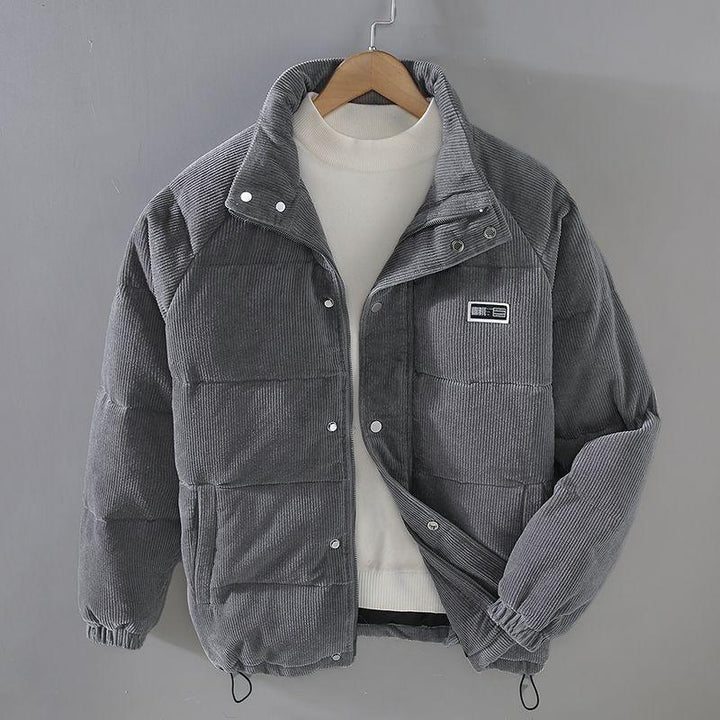 Gray corduroy puffer jacket with snap buttons, white turtleneck sweater inside, displayed on hanger