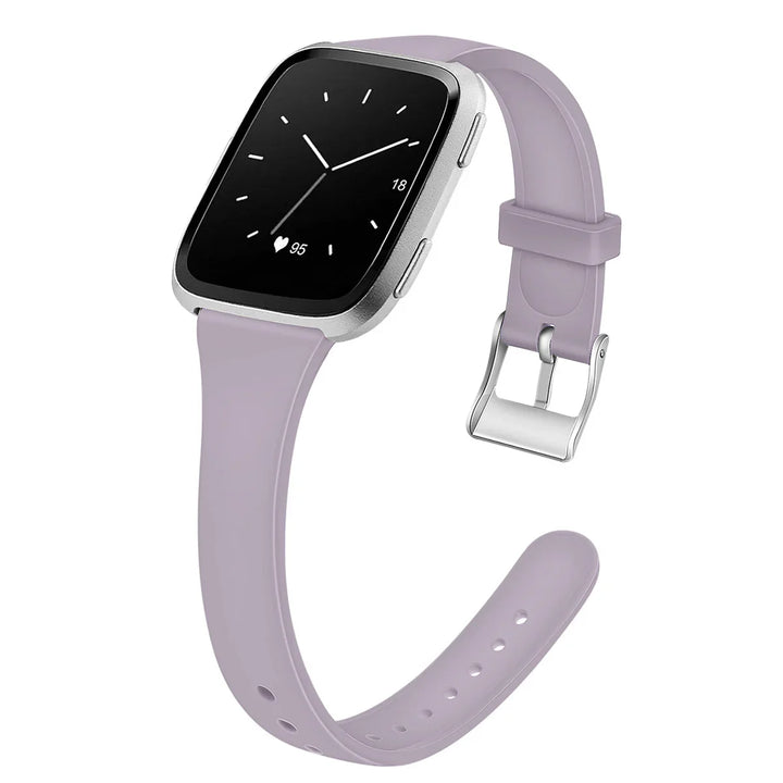 Smartwatch with silver case, black screen showing time and heart rate, lavender silicone strap