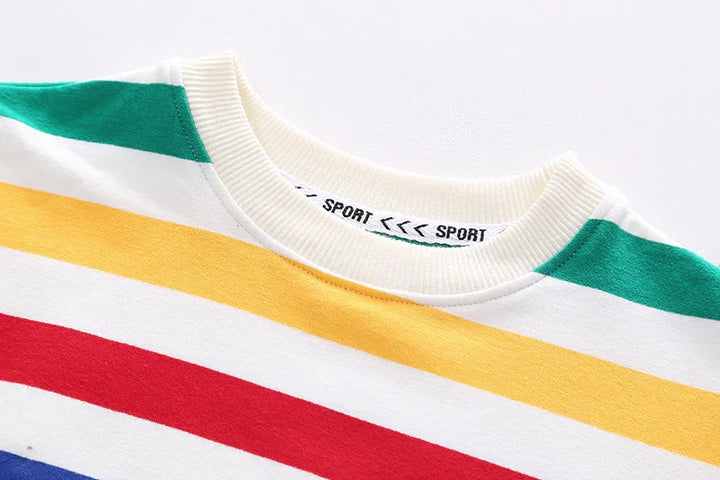 Close-up of colorful striped crewneck shirt with green, yellow, red, and blue stripes and a ribbed white collar