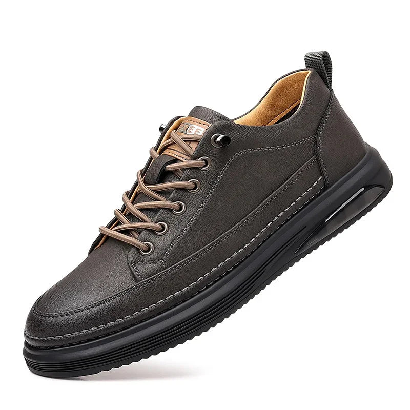 modern black leather sneaker with brown laces and cushioned sole on white background