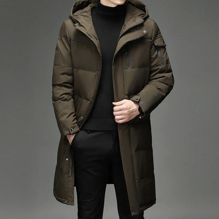 Man wearing stylish olive green padded winter coat with hood and black turtleneck sweater