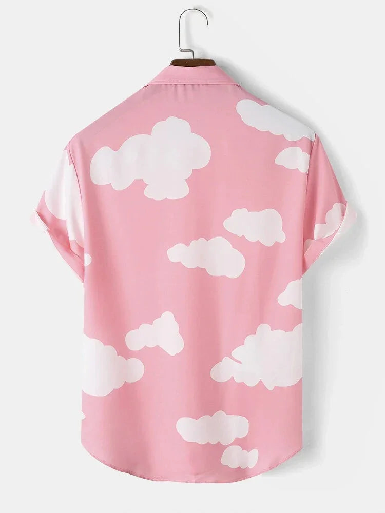 Pink short-sleeve shirt with white cloud pattern hanging on wooden hanger