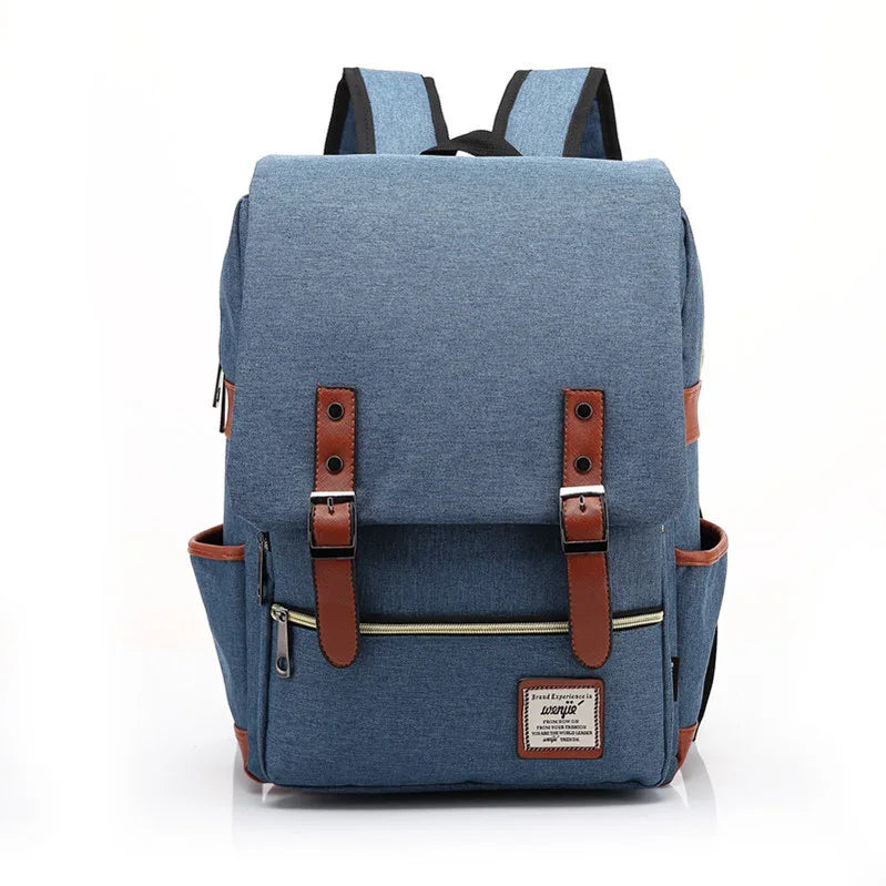 Blue canvas backpack with brown leather straps, front zipper pocket, and side pockets