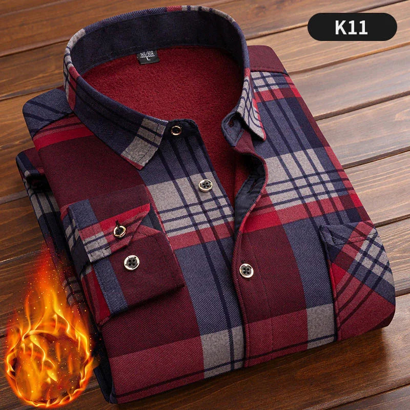 Folded warm flannel plaid shirt in red blue and gray on wooden surface with fire graphic, style K11