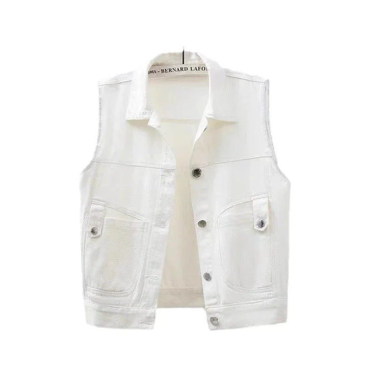 White sleeveless denim vest with button front and two front flap pockets on hanger