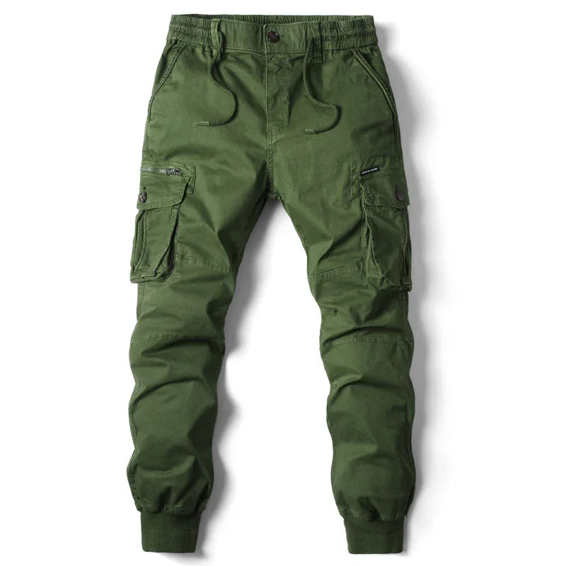 Green men's cargo jogger pants with elastic waistband and multiple pockets on white background