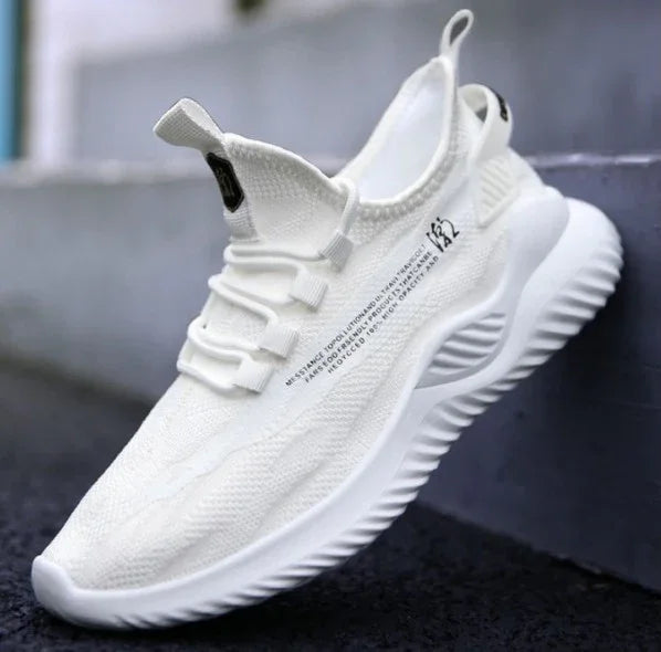 Modern white knit fabric sneaker with thick wavy sole and black text detail on side