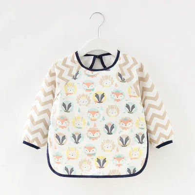 Baby long sleeve bib with animal print front and beige zigzag pattern sleeves, navy trim