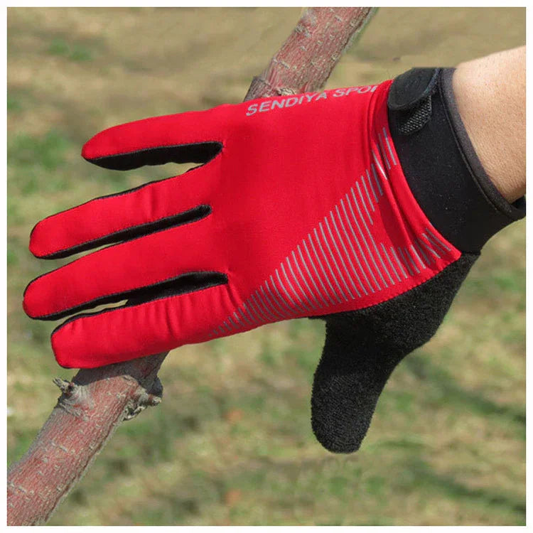 Red and black SENDIYA Sports glove gripping a tree branch outdoors with reflective stripes