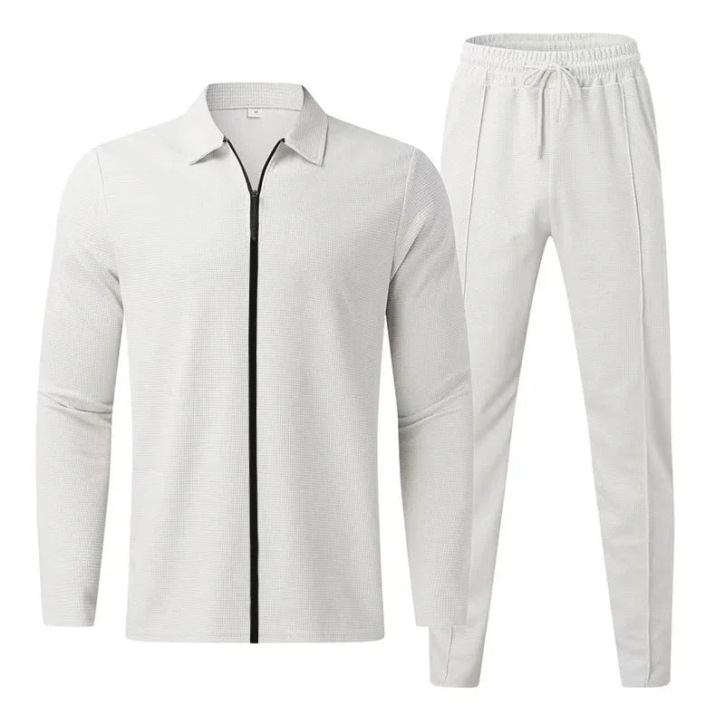 White textured men's tracksuit with black zipper jacket and drawstring pants