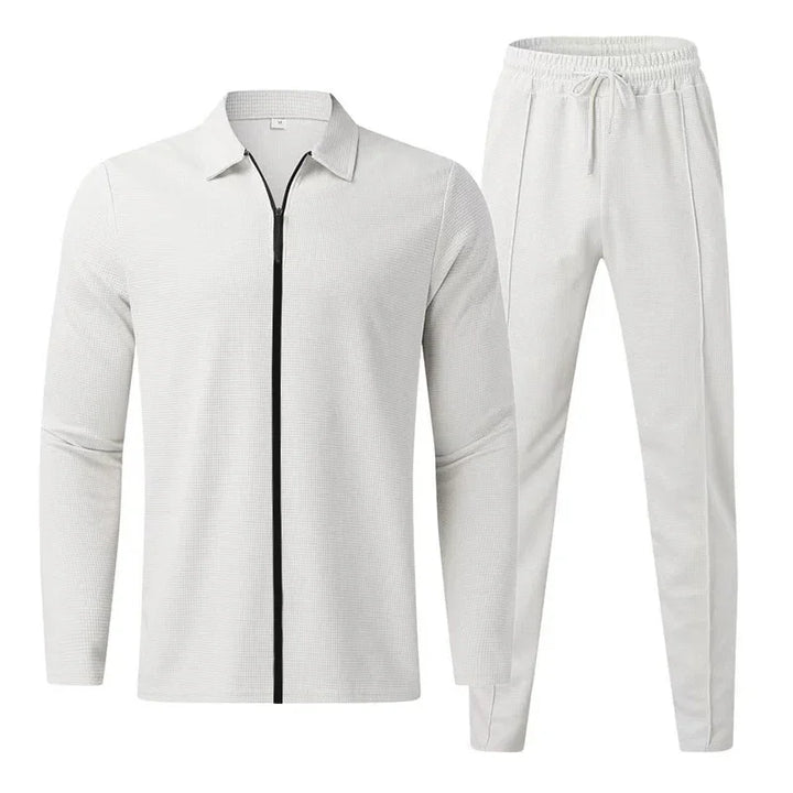 White textured men's tracksuit with black zipper jacket and drawstring pants