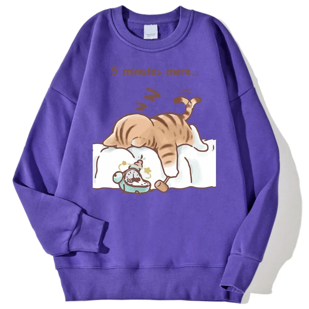 Purple sweatshirt with cartoon cat sleeping on a pillow and text "5 minutes more..." with an alarm clock