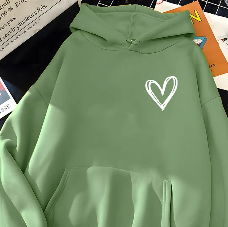 Green hoodie with white sketched heart design on chest, pocket, and hood detail