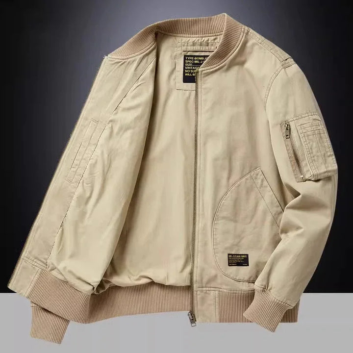 Beige bomber jacket with ribbed cuffs and hem, front pockets, and zippered sleeve pocket