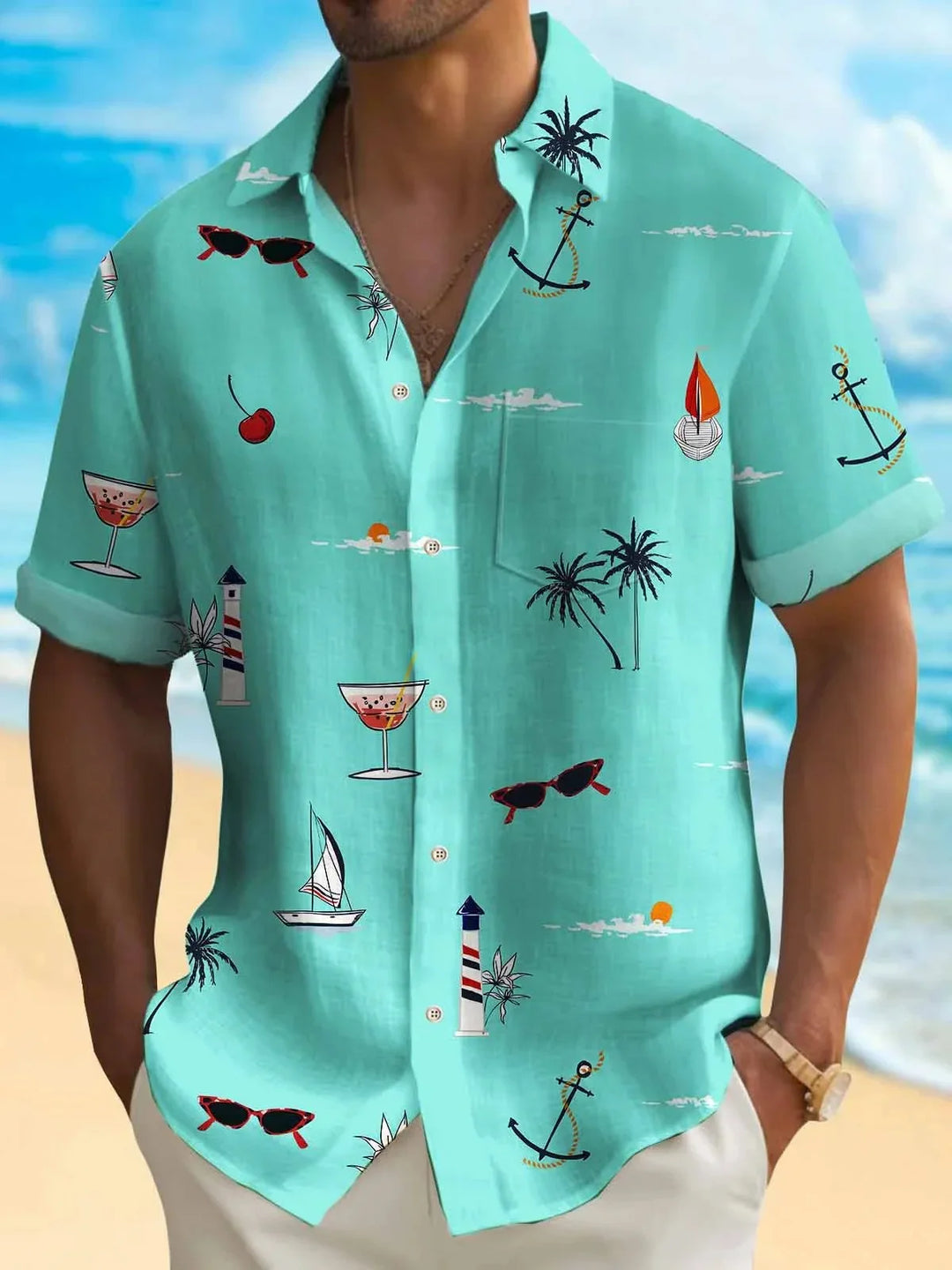 Men's turquoise short sleeve beach shirt with sailing, sunglasses, palm tree, anchor, and cocktail prints