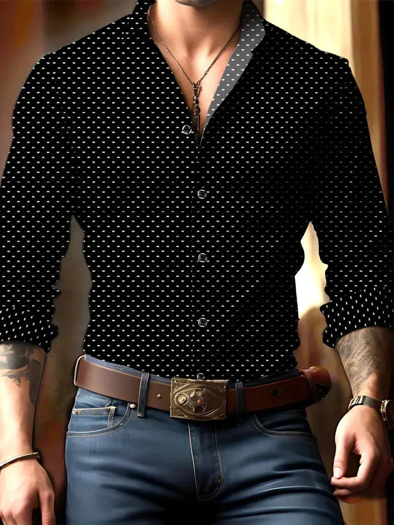 Man wearing black patterned button-up shirt paired with jeans, brown belt with ornate buckle, and necklace