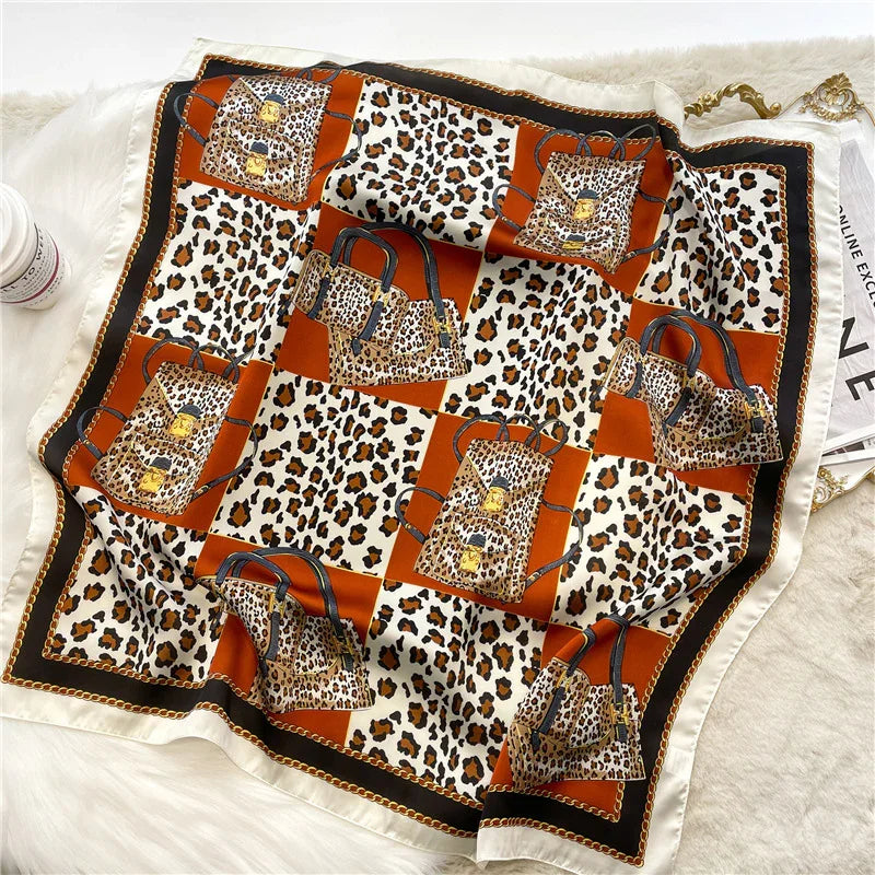 Silk scarf with leopard print and brown handbag pattern on checkered brown and white background