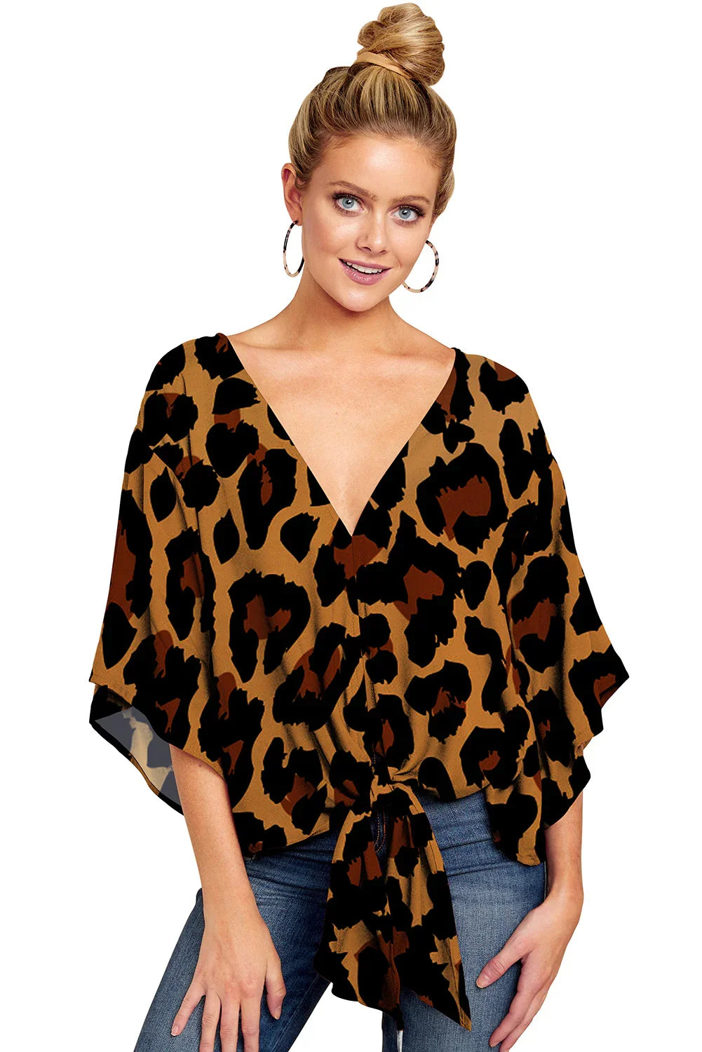 Blonde woman wearing leopard print V-neck blouse with tie front and hoop earrings