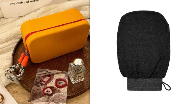 Small rectangular yellow cosmetic bag with red zipper on wooden tray, perfume bottle, and decorative stickers