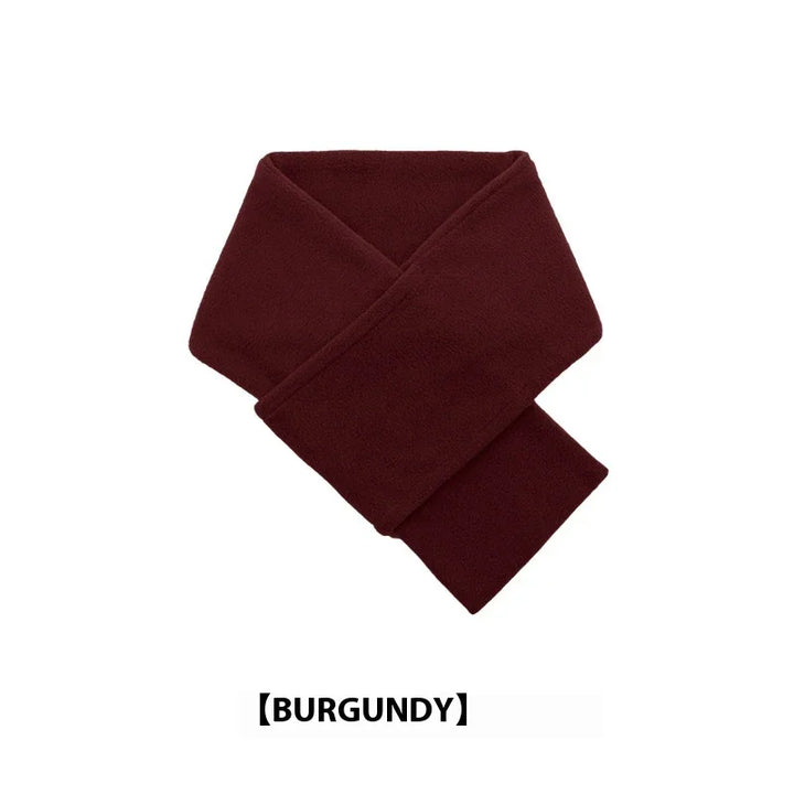 Soft burgundy fleece scarf folded on white background, warm winter accessory