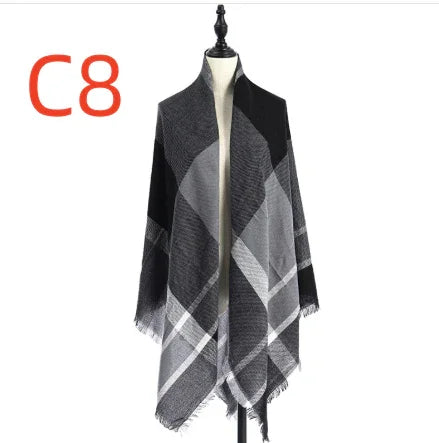 Black and gray plaid shawl with fringed edges displayed on dress form, labeled C8