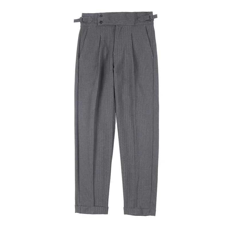 Gray pinstripe dress pants with pleats and adjustable side buckles on white background