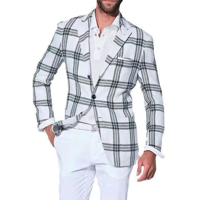 Man wearing a white blazer with black plaid pattern, white shirt, and white pants