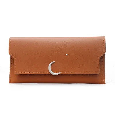 Brown leather wallet with silver crescent moon and star on front flap