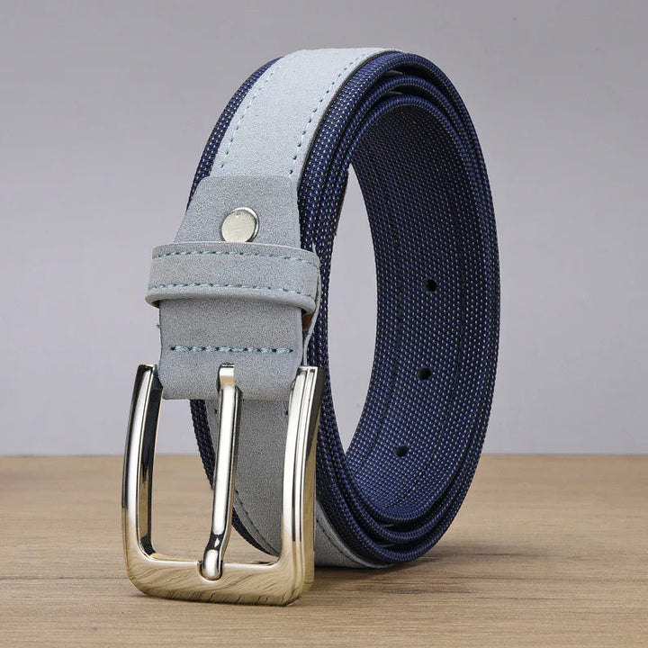 Navy blue and light gray suede fabric belt with silver metal buckle on wooden surface