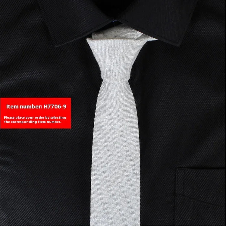 White slim tie on black dress shirt with collar and pocket, item number H7706-9 label
