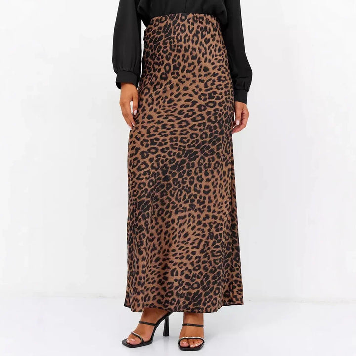 Woman wearing a brown and black leopard print maxi skirt with black strappy heels