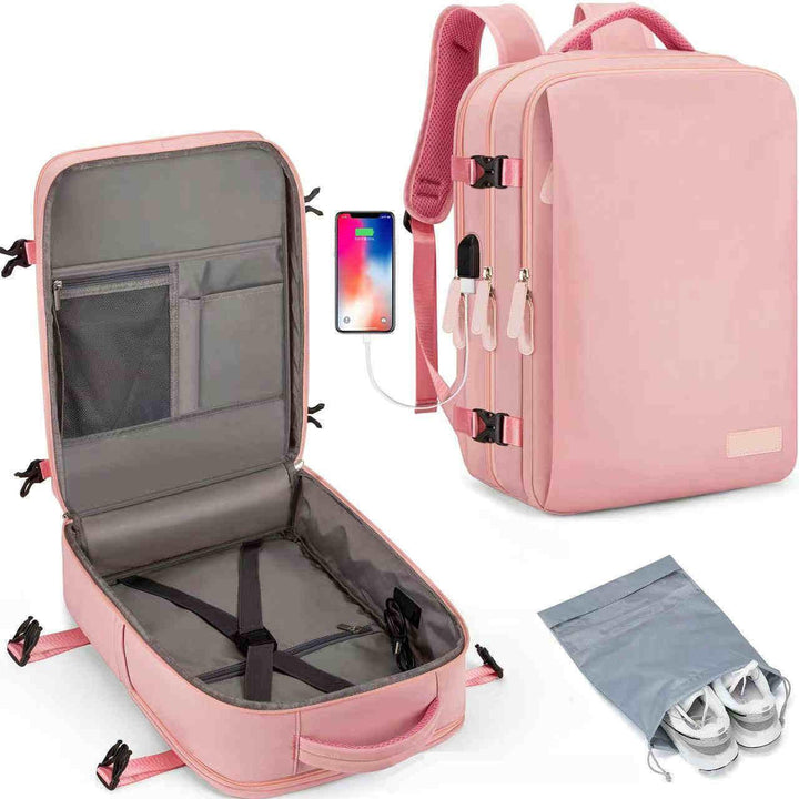 Pink travel backpack with multiple compartments, USB charging port, and separate shoe bag