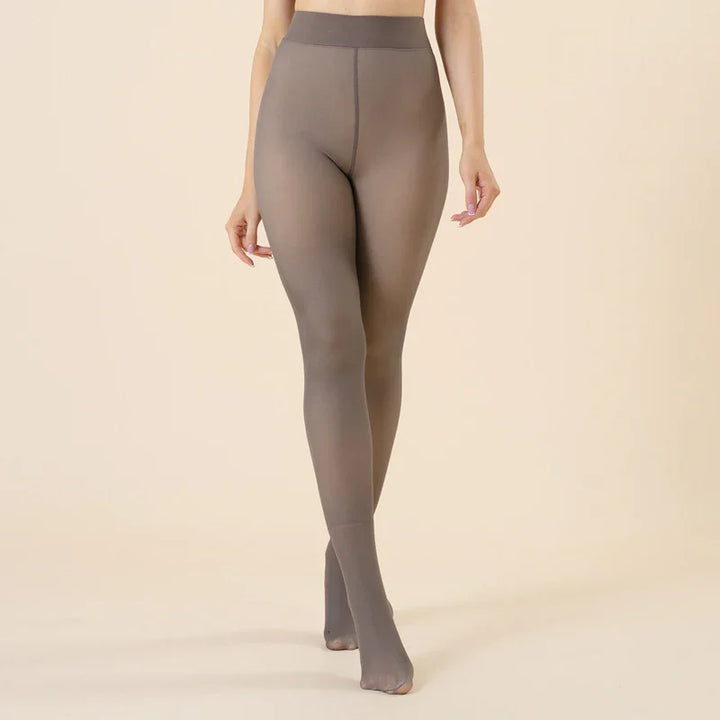 Woman wearing taupe seamless sheer tights against beige background