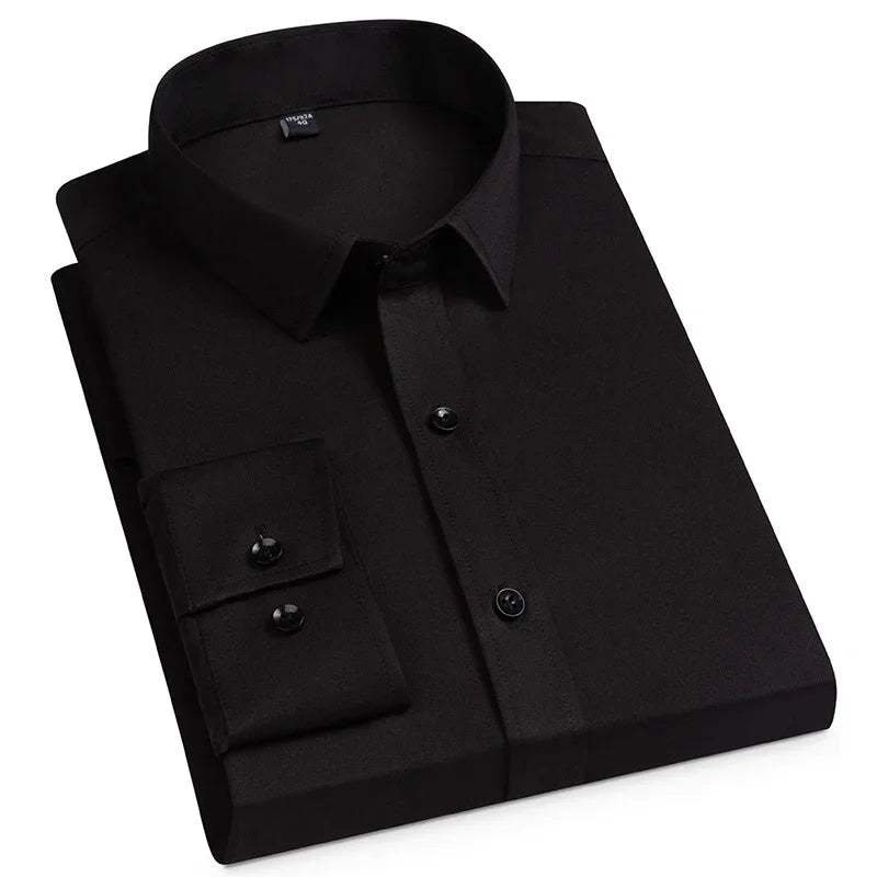 Folded black dress shirt with long sleeves and black buttons on white background