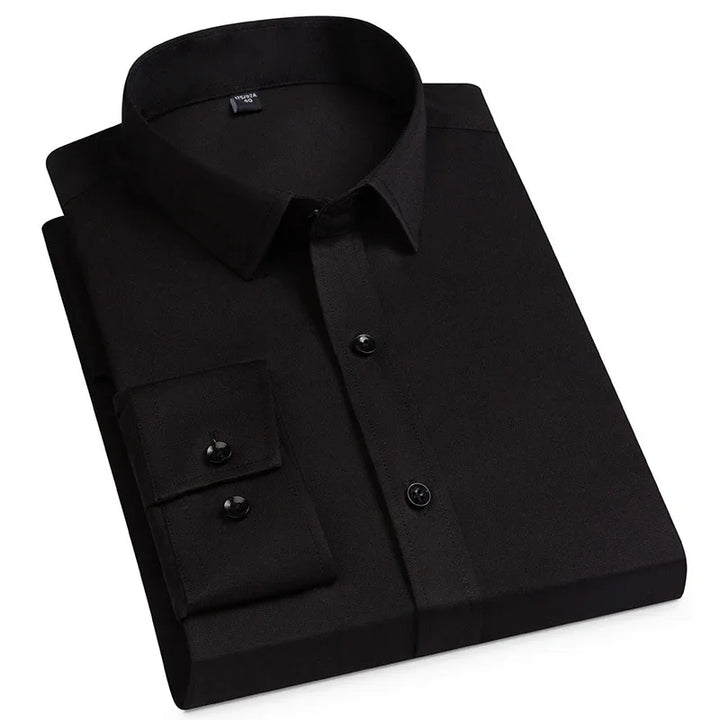 Folded black dress shirt with long sleeves and black buttons on white background