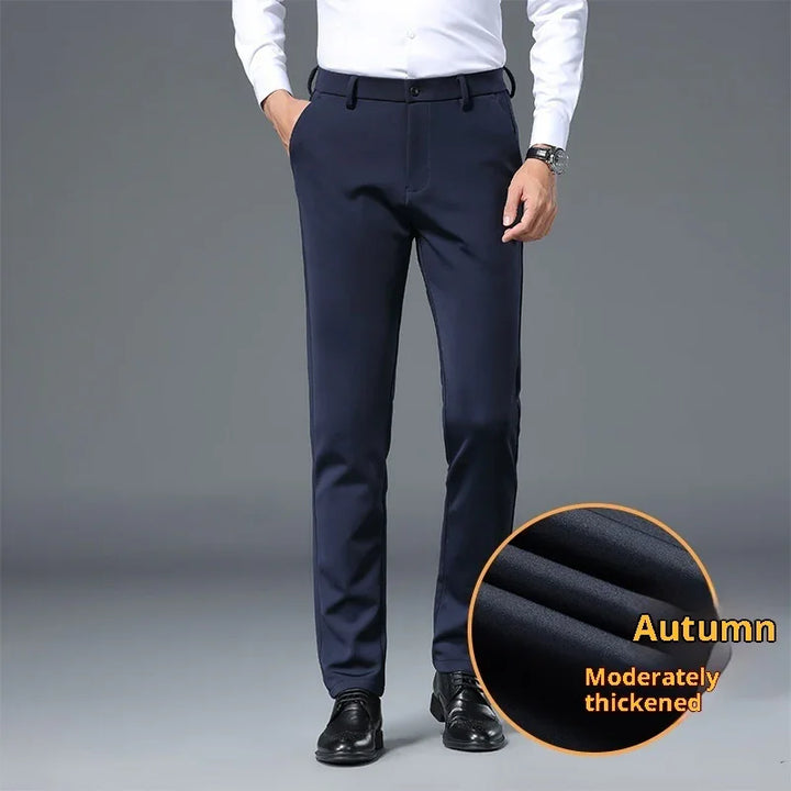 Man wearing navy blue slim-fit trousers with black dress shoes and white shirt, fabric close-up showing thickened autumn material