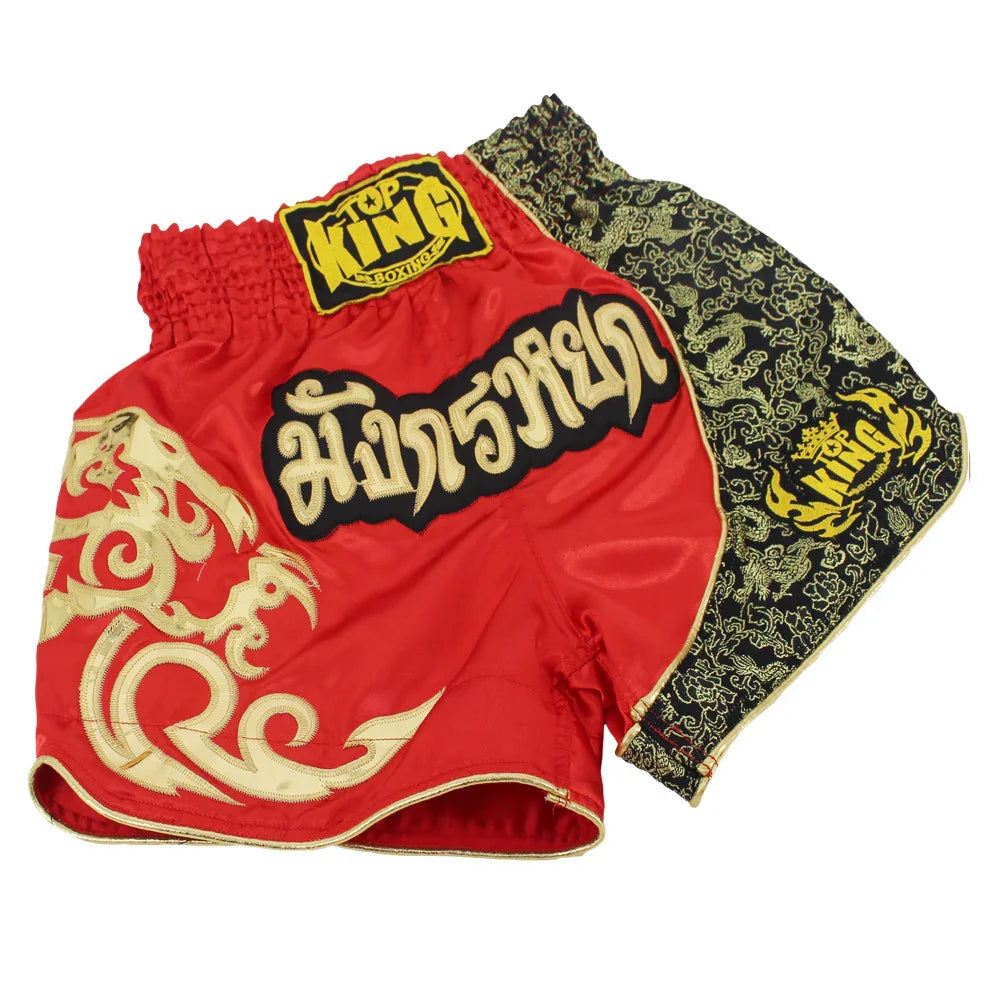 Red Muay Thai shorts with gold dragon embroidery and black pattern, Top King branding